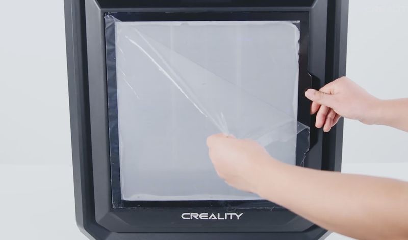 Removing all the remaining protective film from the Creality Sermoon D3 3D printer.