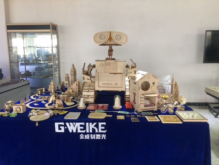 A stand with product samples made with the Gweike Cloud laser cutter and engraver.