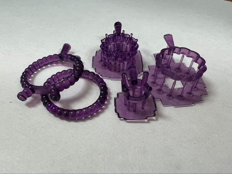 a purple different ring models printed on the Anycubic Photon D2