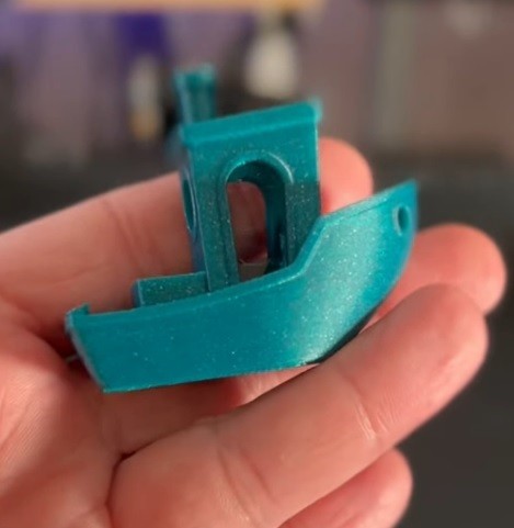 a green model printed on the Creality Ender-3 S1 Plus 3D printer