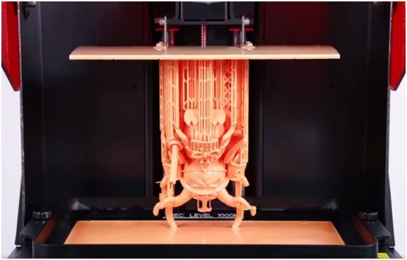A orange model printed on the Creality Halot Max 3D printer