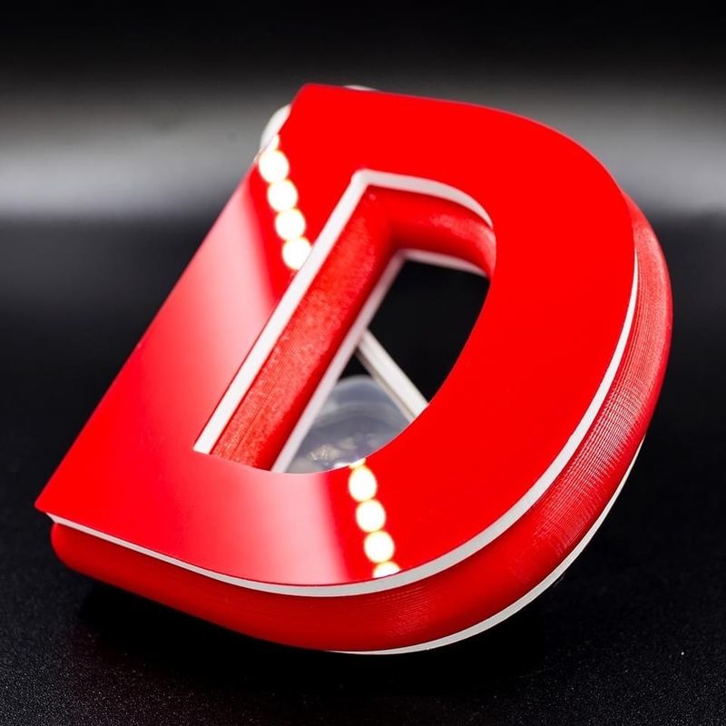 a red model printed on the Flashforge AD1 Channel Letter 3D Printer