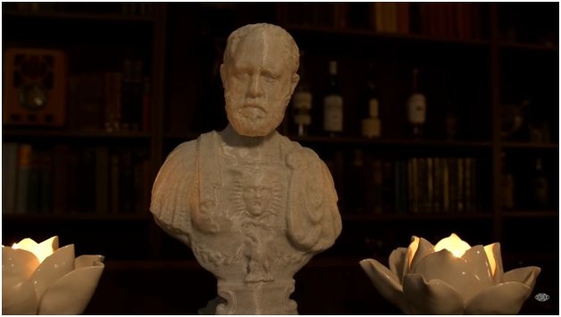 A white model bust of a man printed on the Flashforge Adventurer 4 3D printer