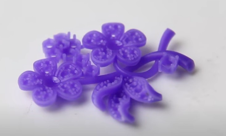 a purple model printed on the Flashforge WaxJet 400 3D Printer