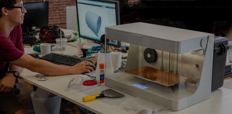 a man prints on the Markforged Onyx Pro 3D printer 