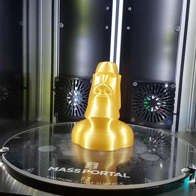 Look at its great performances. This Moai 3D model has been printed with Spectre gold PLA. Notice how smooth and shiny it is.