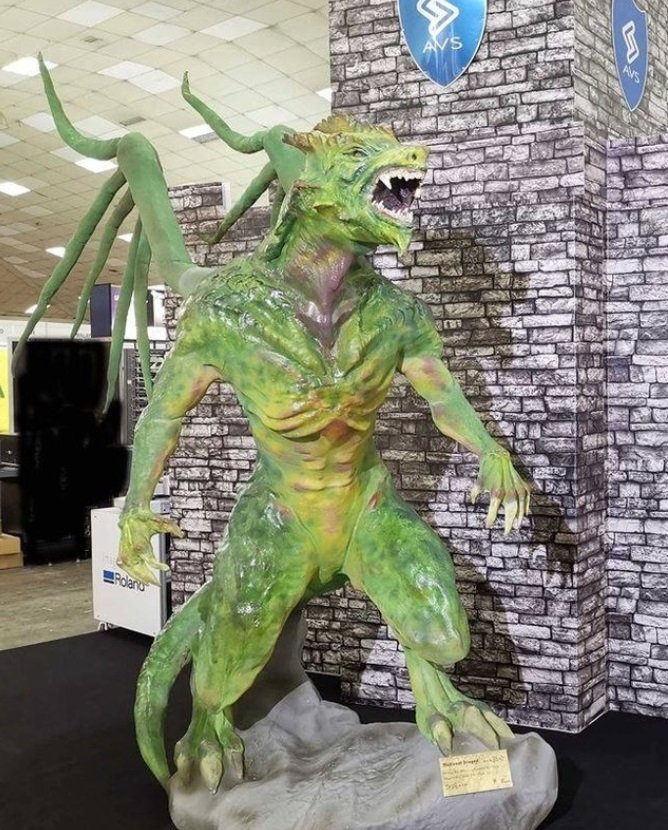 a green model dragon printed on the Massivit 1800 Pro 3D printer