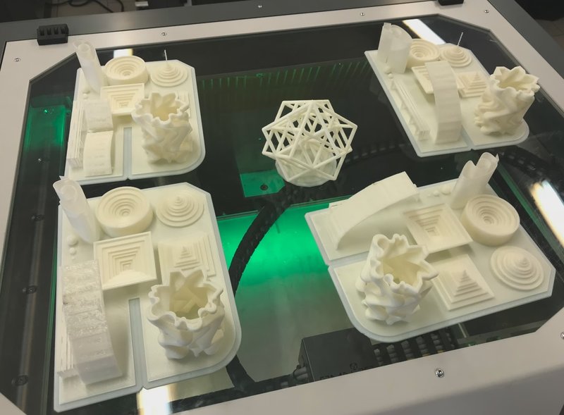 a different white model printed on the Omni3D Factory 2.0 3D printer