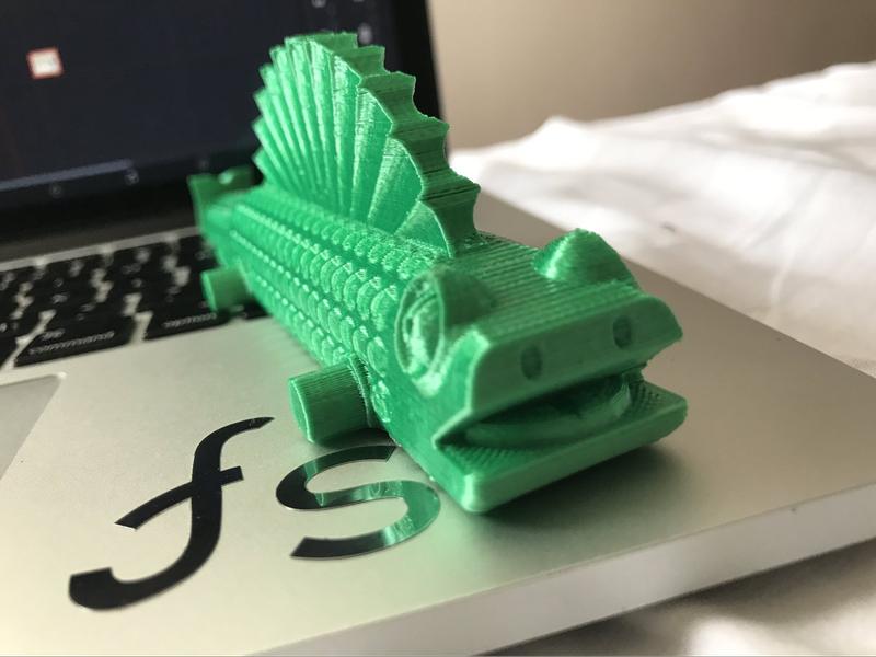 the green plastic fish rinted on the optimus c1 3d printer