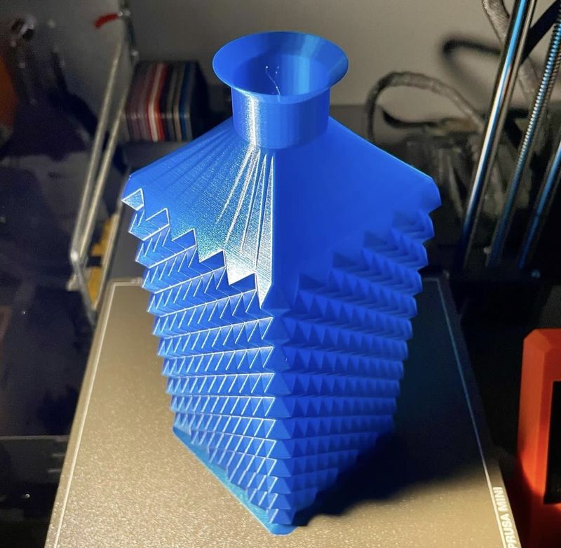 a blue model printed on the Original Prusa MINI+ Kit 3D Printer
