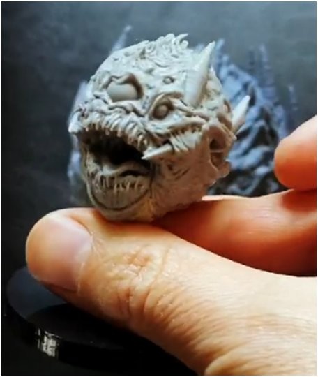 a grey model head monster printed on the Phrozen Sonic Mighty 4K