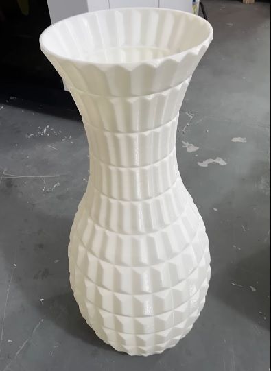 a white model printed on the Piocreat G12 Pellet 3D Printer