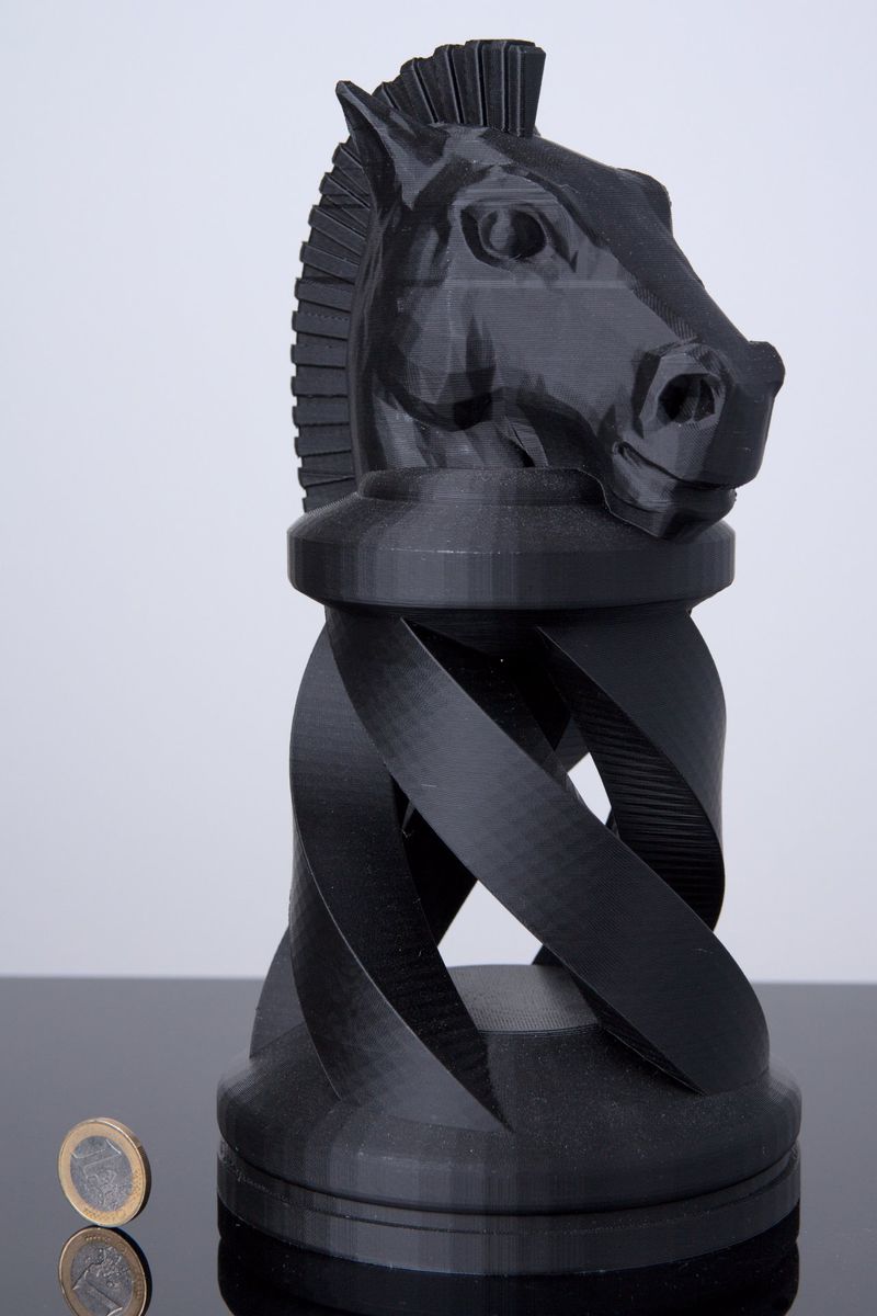a black model printed on the TRILAB DeltiQ 2 Plus 3D Printer