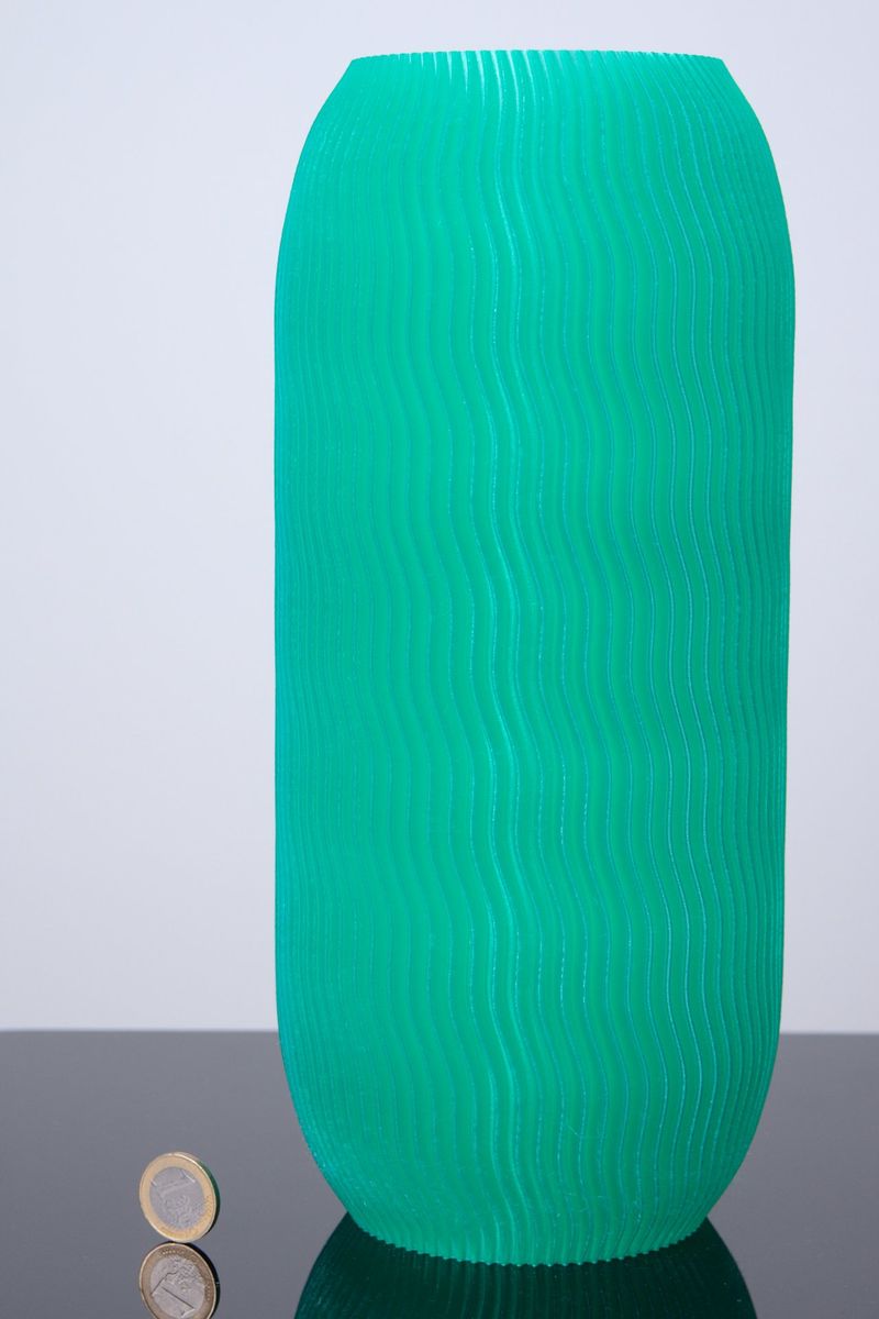 a green model printed on the TRILAB DeltiQ 2 Plus 3D Printer