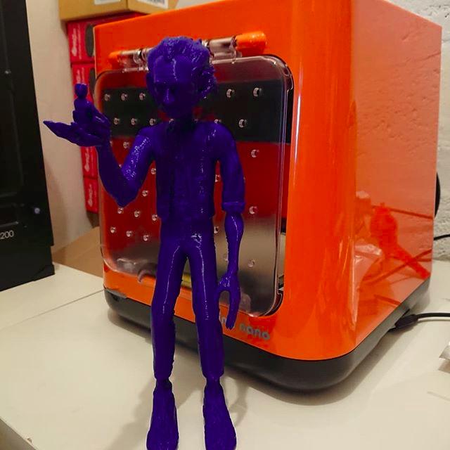 The build area is 4.7 x 4.7 x 4.7 inches (120 x 120 x 120 mm). Larger models can be printed in parts and then assembled using glue, just like the big figure shown in the picture below.