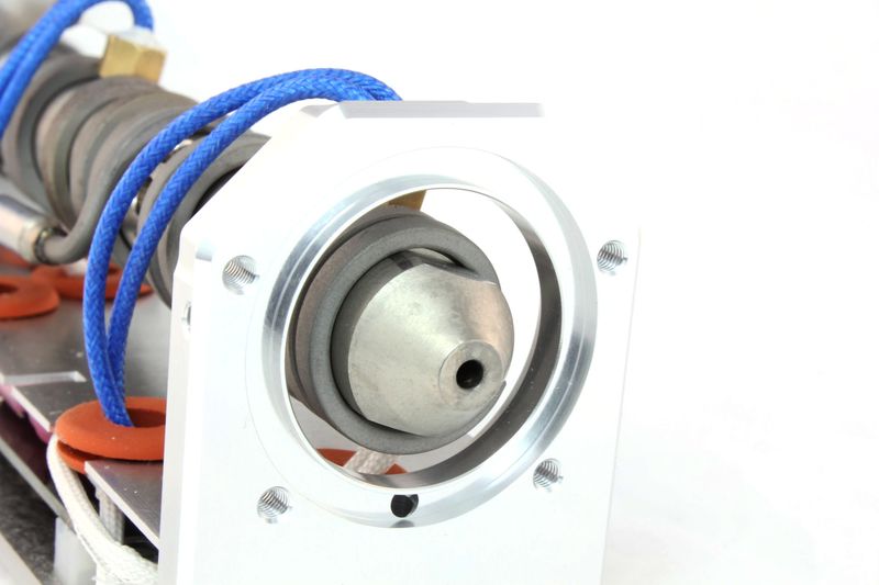 a abrasive-resistant steel nozzle on the Dyze Design Typhoon Filament Extruder
