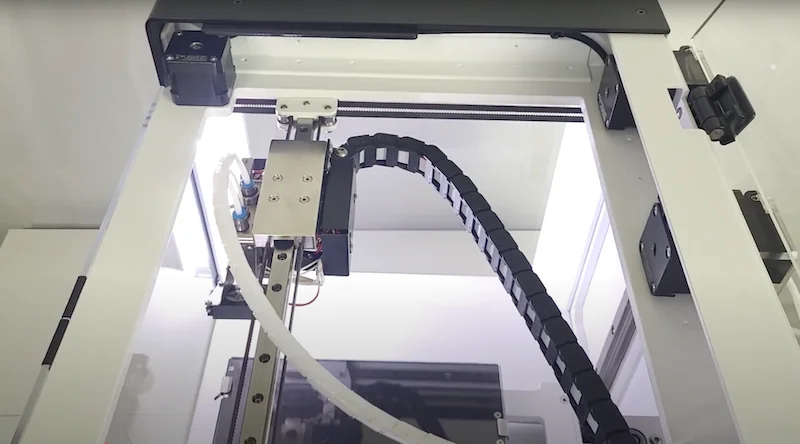 Anisoprint Composer A3 3D printer interior, showing mechanical components and wiring, with visible parts suggesting advanced composite printing capabilities.