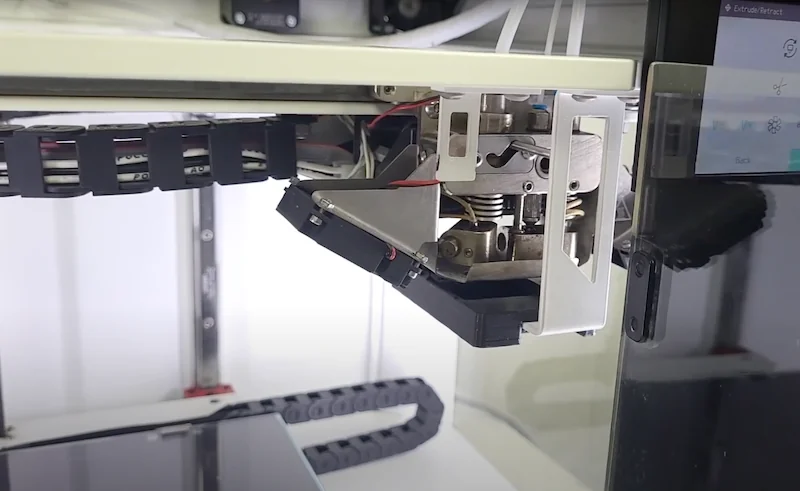 Anisoprint Composer A4 3D printer with intricate internal components and touchscreen, known for creating high-performance, composite printed parts.