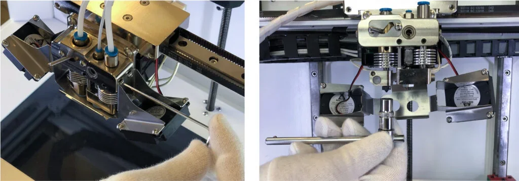 Anisoprint Composer A4 printer head with metal components and tubing, showcasing intricate design and precision engineering.