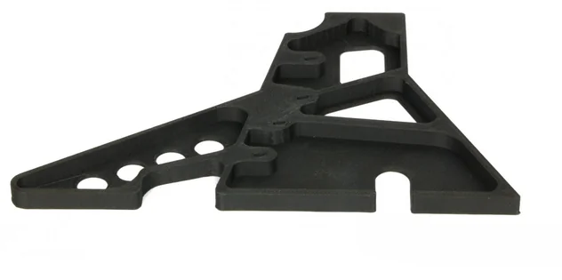 Black 3D-printed geometric part with cutouts, created by Apium P400.