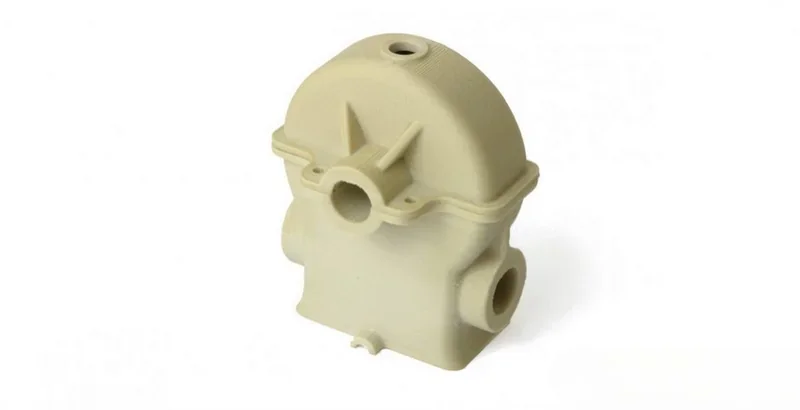 Cream-colored 3D-printed component created by Apium P400, featuring multiple cylindrical openings and smooth contours.