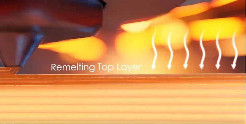 Apium P400 remelting top layer process with heating elements glowing, demonstrating precision 3D printing technology and surface finishing.