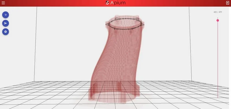 Apium P400 CAD model of a 3D-printed structure shown in a red wireframe on a grid platform, with branding in the interface.