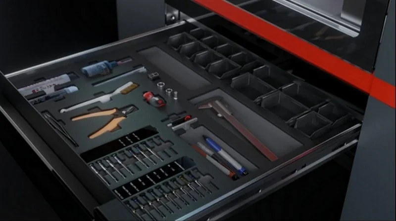Apium P400 tool drawer with organized tools and components, showcasing precision engineering and design in a functional industrial setting.