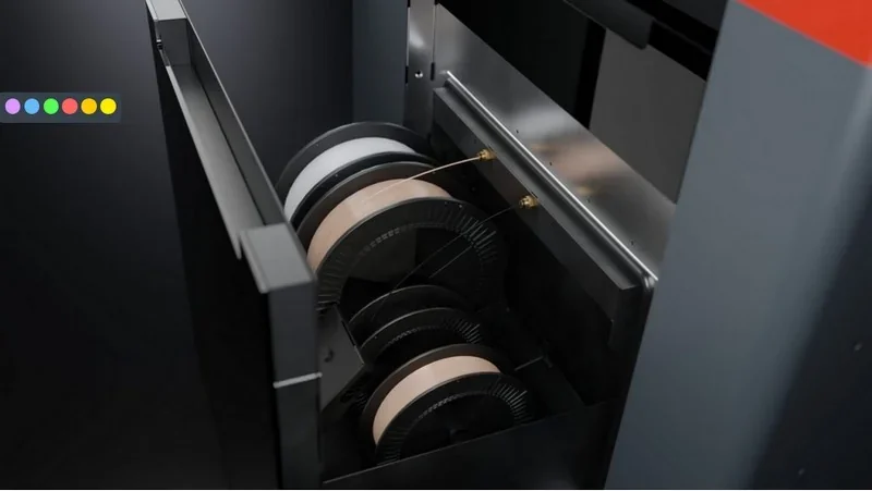 Apium P400 3D printer open filament chamber, displaying multiple spools of printing material in a sleek, industrial design setting.