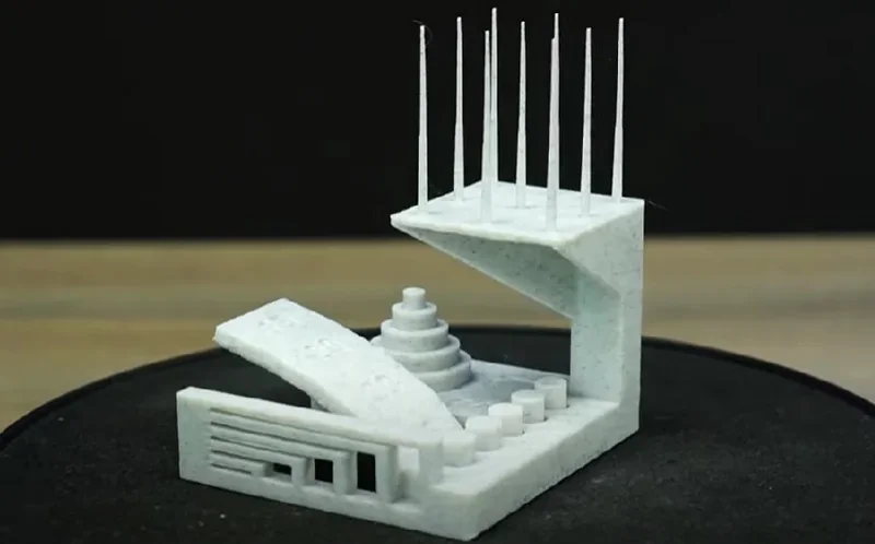 Bambu Lab H2D Pro 3D-printed model showcasing intricate geometric details and precision, set against a dark background.