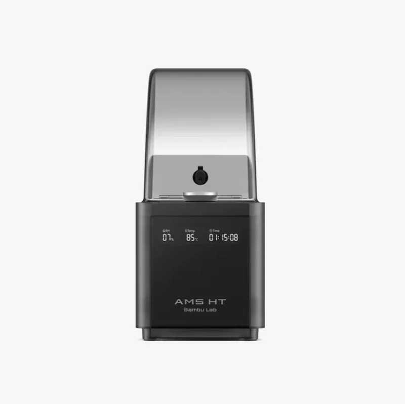 Bambu Lab H2D Pro 3D printer with transparent lid, digital display showing humidity, temperature, and time, labeled "AMS HT" on the front.