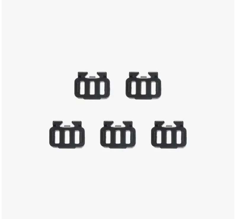 Five black 3D-printed clips created by bambu lab h2d pro, arranged on a white background, showcasing precise, uniform design.