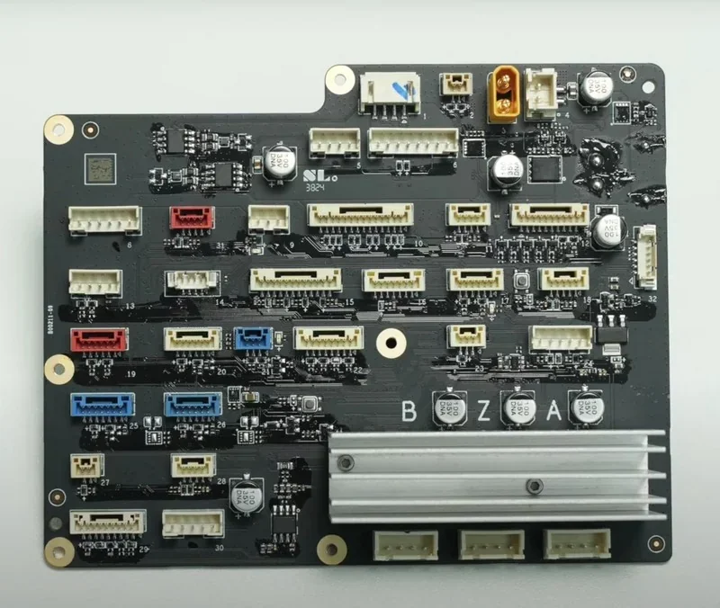 Bambu Lab H2S control board with connectors and components placed on a black circuit board, displaying intricate wiring and electronic parts.