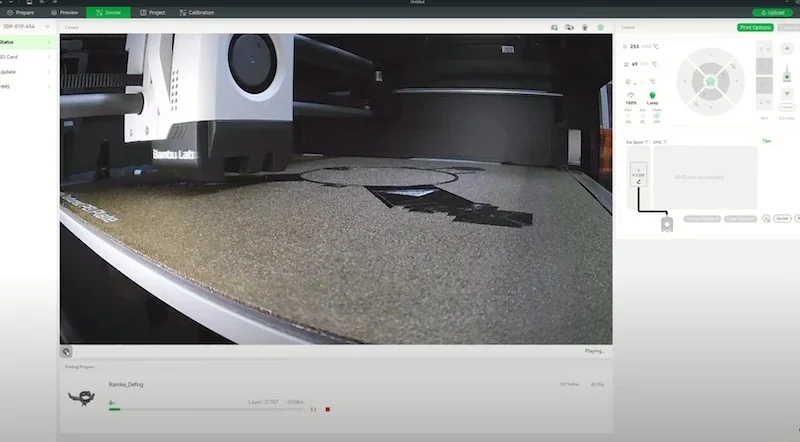 Bambu P1S 3D printer in action, printing intricate parts on a flat surface, visible interface showing progress and specs on-screen for monitoring.