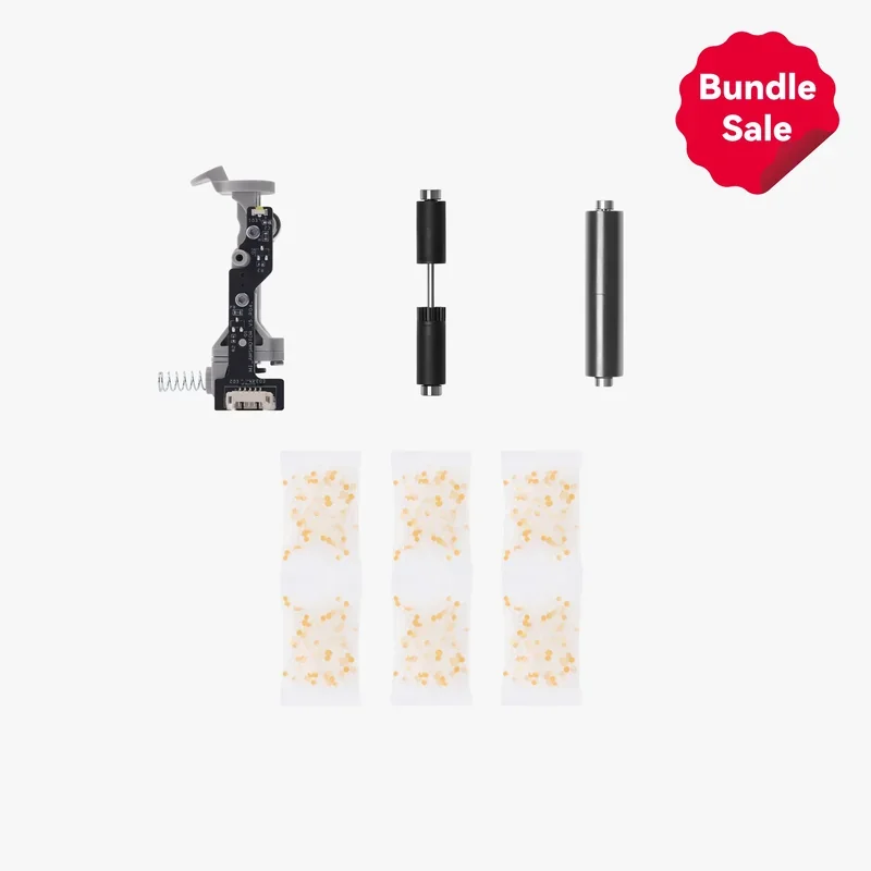 Bambu P1S printer parts and accessories on display, featuring rollers, a circuit component, and filament bags, with a "Bundle Sale" label in the corner.