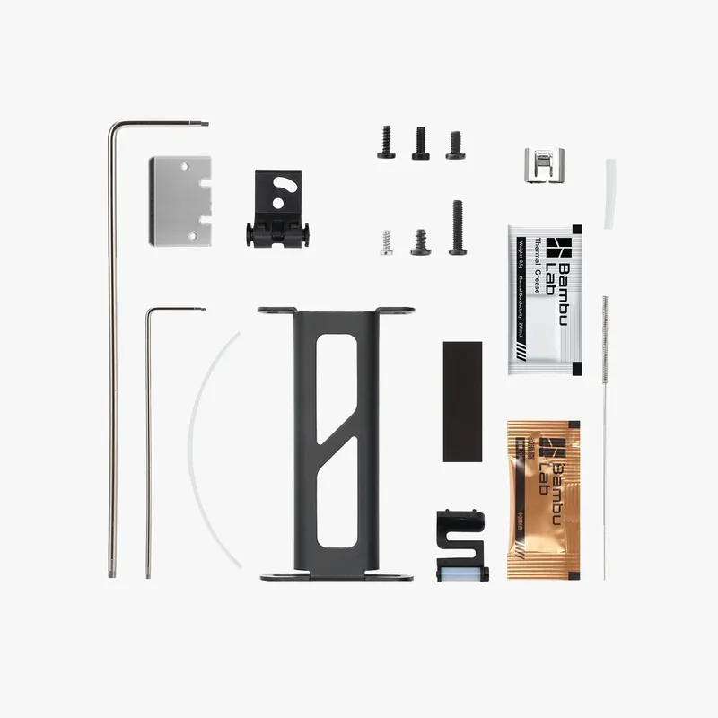Bambu P1S 3D printer parts display, showing various screws, brackets, and Bambu Lab branded packets, showcasing assembly components.