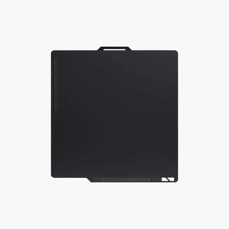 Bambu x1e smooth PEI plate, rectangular with rounded corners, black color, featuring a small tab with etched details on a white background.