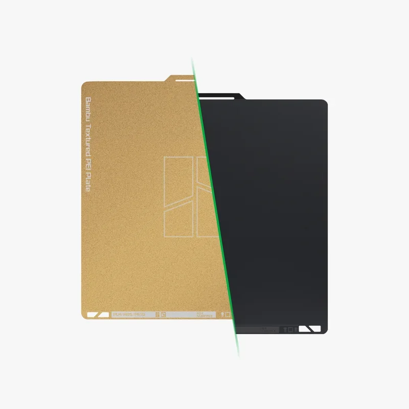 Bambu X1E textured PEI plate, split view showing gold texture and black surface, used for 3D printing, branded with Bambu Lab logo.