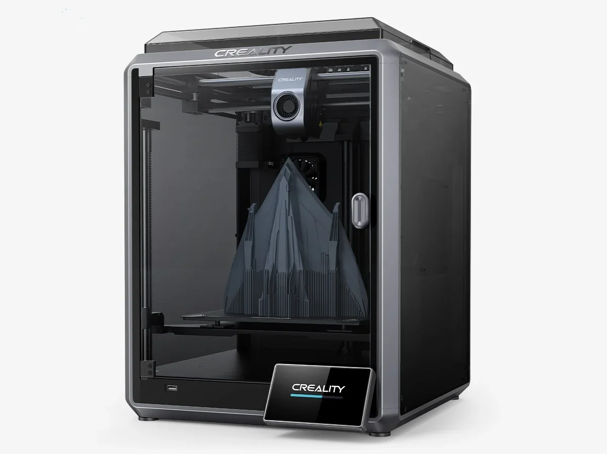 Creality K1 3D printer with geometric object inside, sleek black design, transparent door, Creality branding, on a plain background.