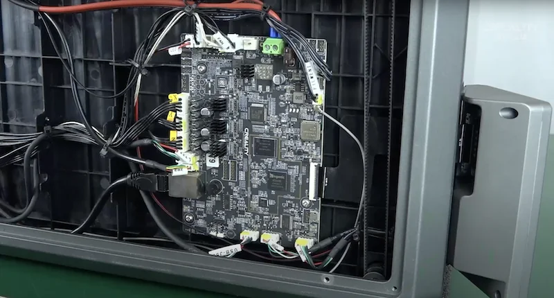 Creality K1 Max motherboard with visible wiring and electronic components mounted inside the 3D printer's casing.