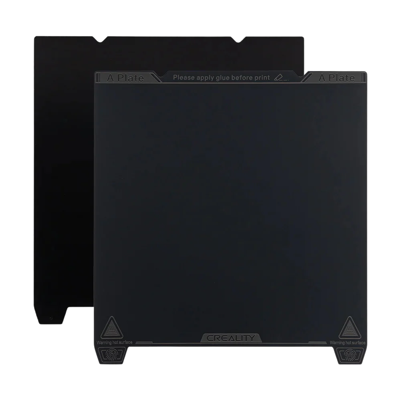 Creality K1 Max build plate, dark surface with "apply glue" text, Creality branding at bottom, warning icons at corners.