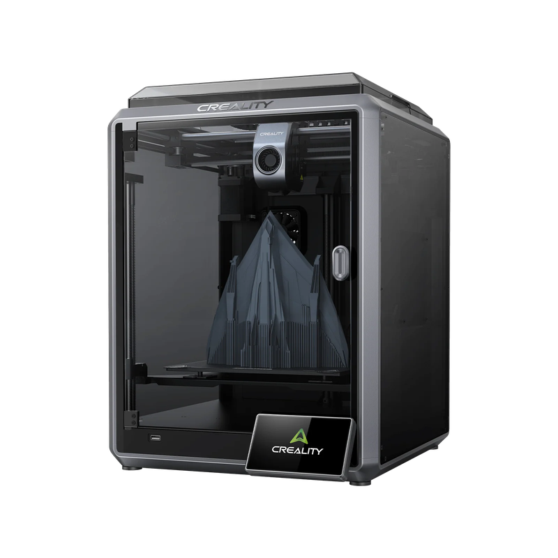 Creality K1 Max 3D printer with a transparent front, showcasing a printed structure. Creality branding visible on top and front display panel.
