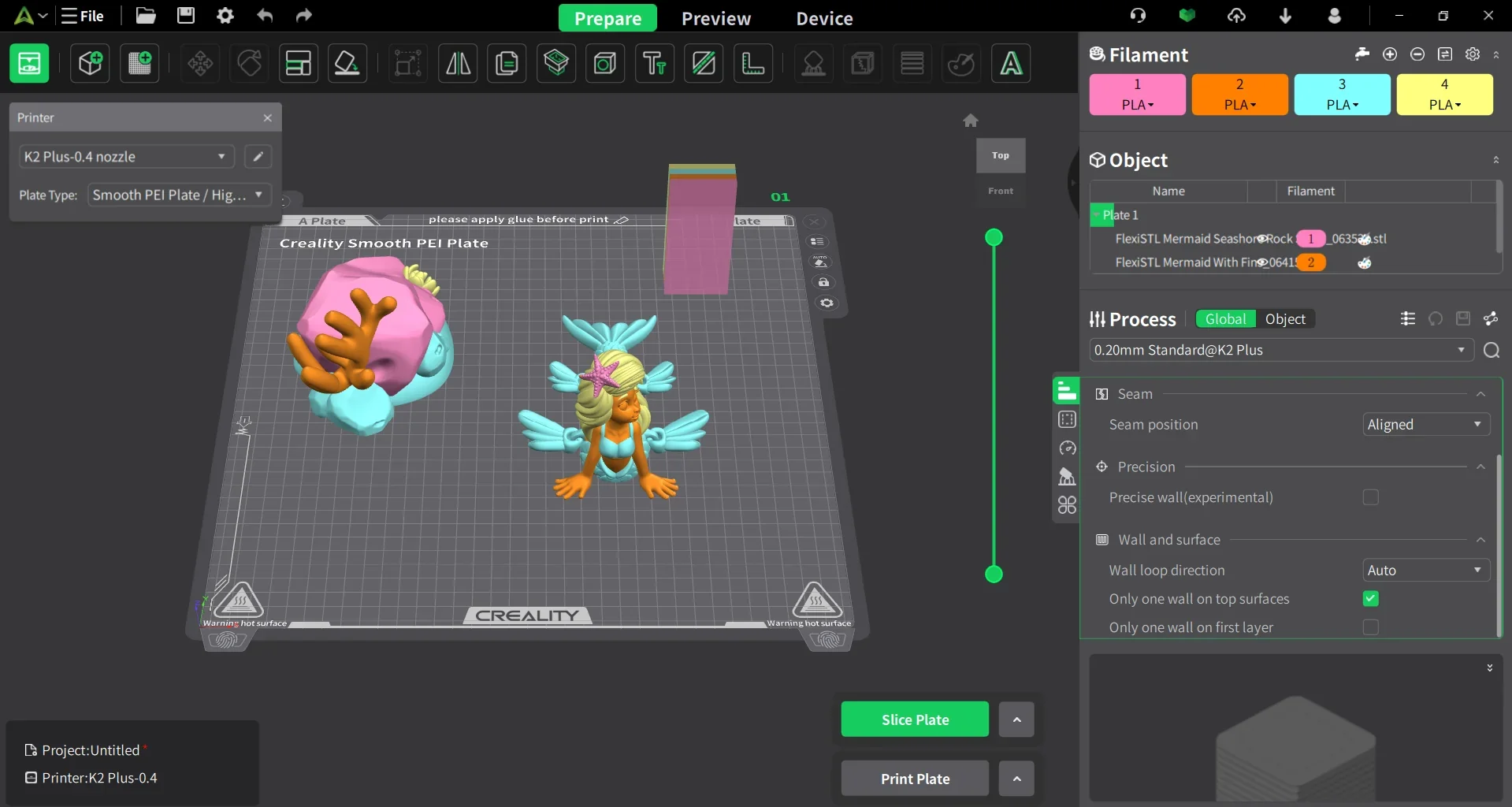 Creality K2 3D printer interface displays colorful mermaid models on a print preview grid, indicating they will be produced by the device.