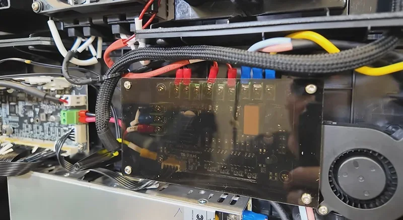 Creality K2 3D printer internal wiring and electronics, showcasing board and connectors, used for precise 3D part creation.