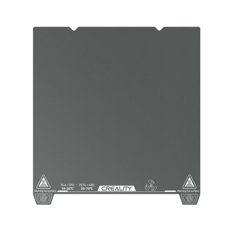 Creality K2 3D printer bed with temperature markings for PLA/TPU and PETG/ABS materials. Creality branding visible on the base.