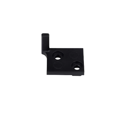 Creality K2 3D-printed black corner bracket with two holes on flat surface, showcasing precision creation by the printer.