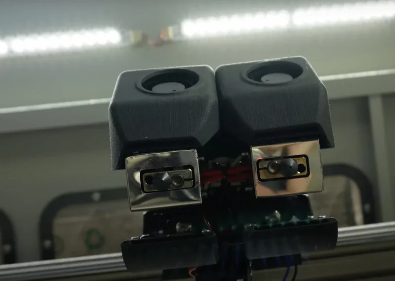 Creatbot D1000 dual extruders in close-up, showcasing the advanced design details within a modern 3D printing environment.