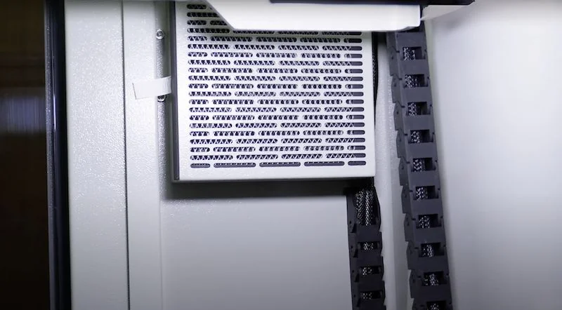 Creatbot D1000 3D printer interior with ventilation grill and cable management.