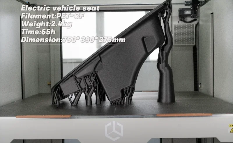 Creatbot D1000 Pro HS prints an electric vehicle seat in PET-CF filament, showcasing size, weight, and print time details inside the 3D printer.