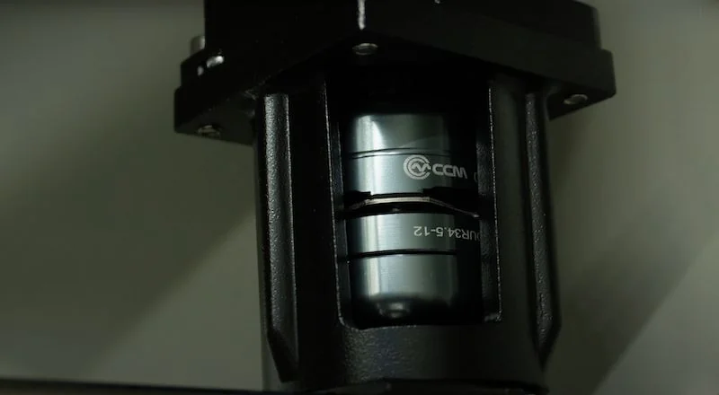 Close-up of a metal component with branding inside the Creatbot D1000 Pro HS 3D printer, showing intricate part detail and assembly.